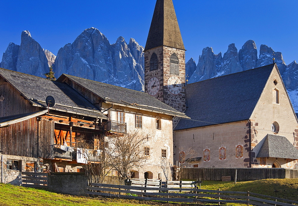 Church of St. Magdalena, Geisler mountains in the background, Villnoss valley, Dolomites, South Tyrol, Italy