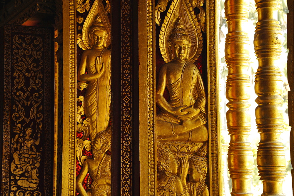 Reliefs with Buddhas at the windows, Wat Ho Pha Bang at the Royal Palace, Luang Prabang, Laos