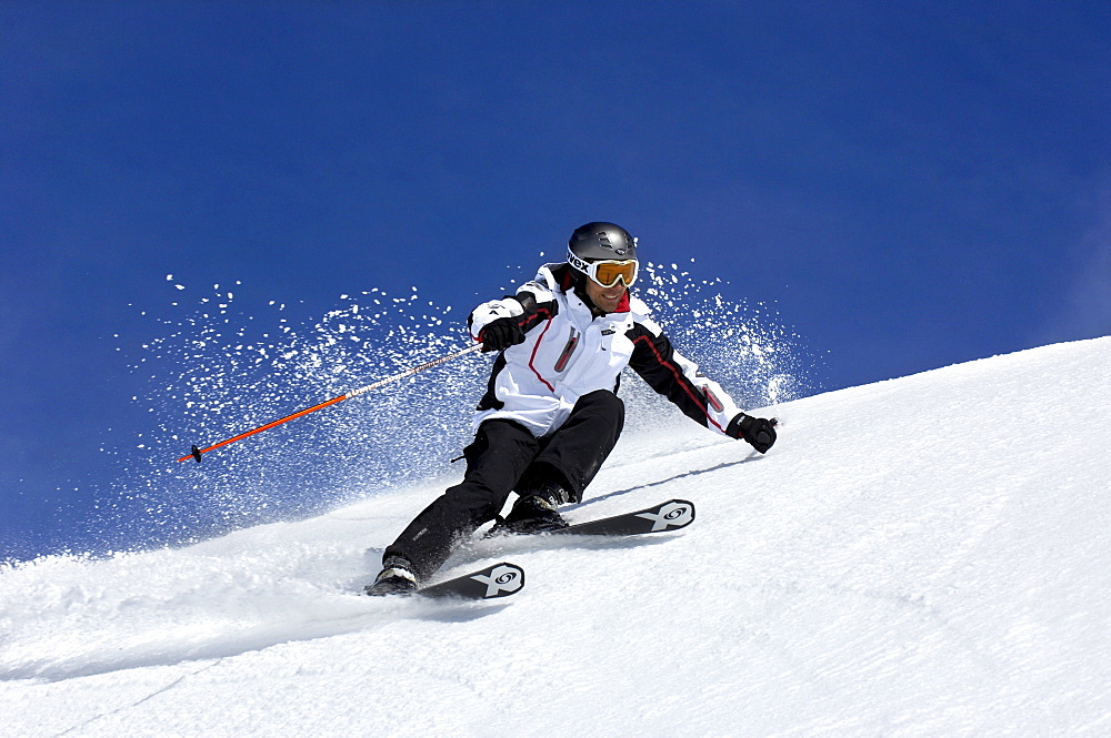 Skier going downhill, South Tyrol, Italy, Europe