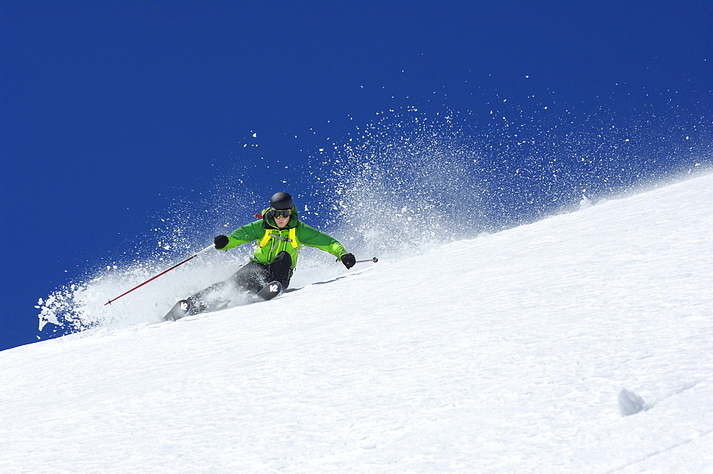 Skier going downhill, South Tyrol, Italy, Europe