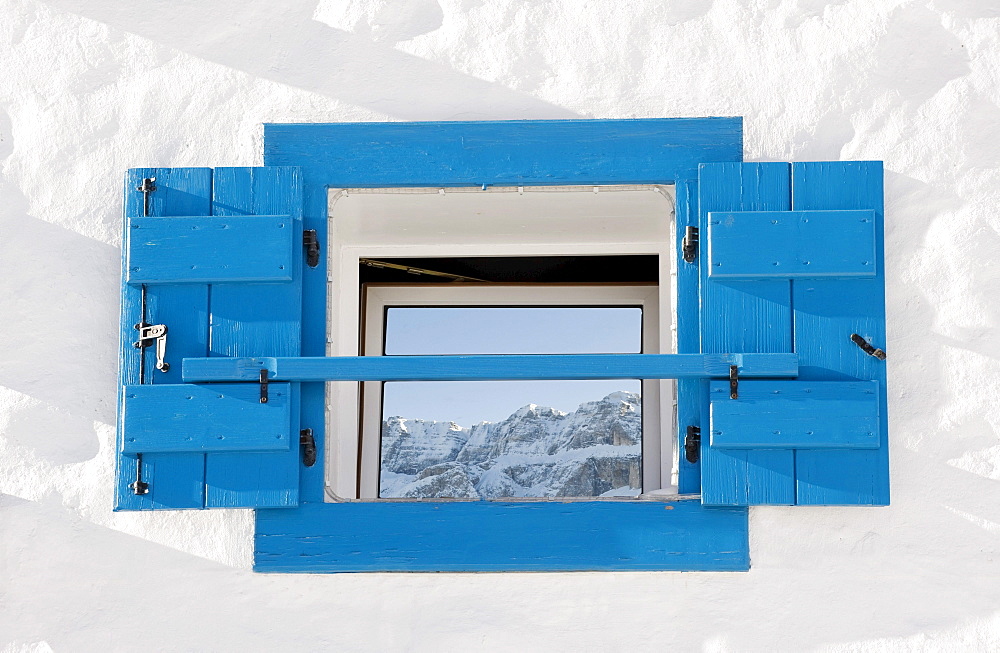 Reflection of snowy mountains on a window pane, Alto Adige, South Tyrol, Italy, Europe