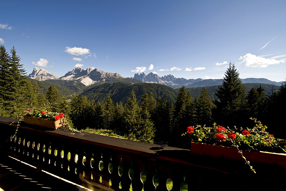 View from a balcony onto mountains in the sunlight, Dolomites, Alto Adige, South Tyrol, Italy, Europe