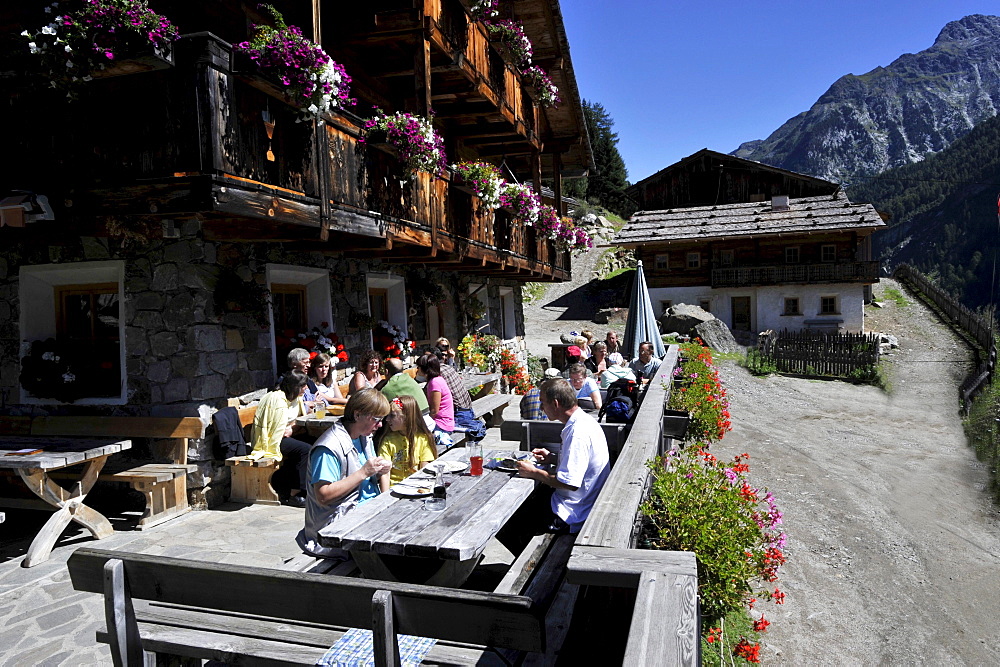 Hiker during eating in the farmhouse inn, Ahrn Valley, Alto Adige, South Tyrol, Italy