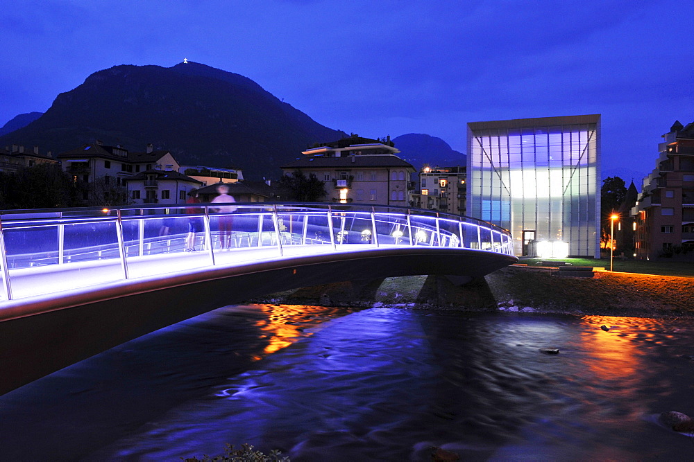 Illuminated bridge in front of museum at night, Bolzano, South Tyrol, Alto Adige, Italy, Europe