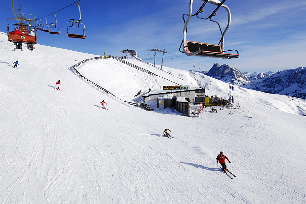 Skiers on the slope in the sunlight, Brixen, Plose mountain, South Tyrol, Alto Adige, Italy, Europe