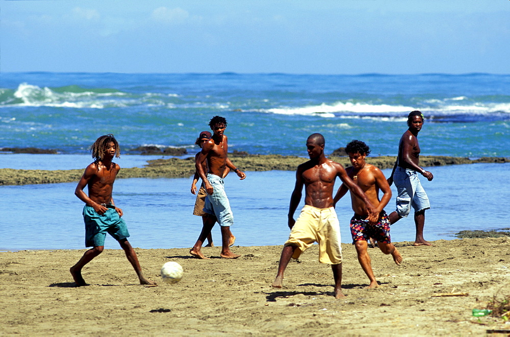 Boys playing football on the beach, Puerto Viejo, Costa Rica, Caribbean, America