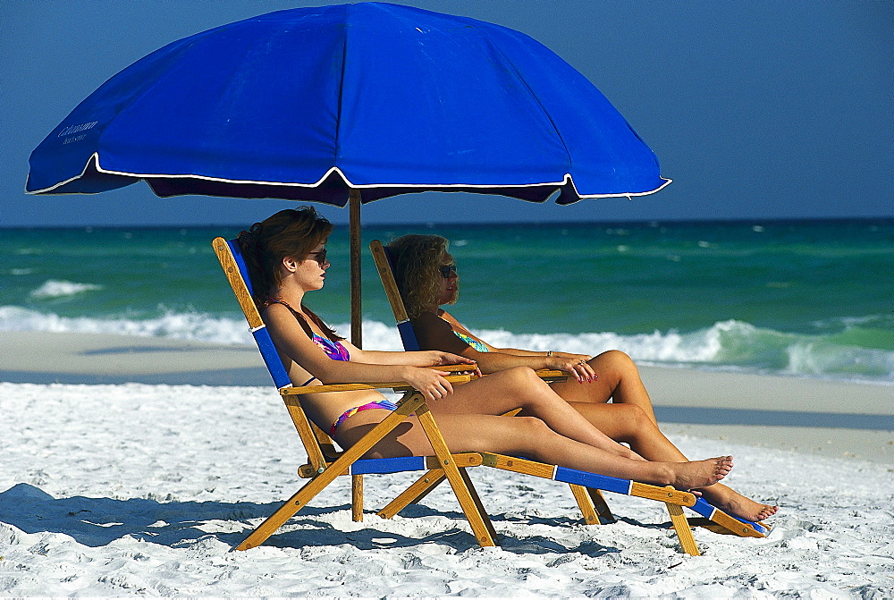 Women under a sunshade on the beach, Panama City, Florida, USA, America