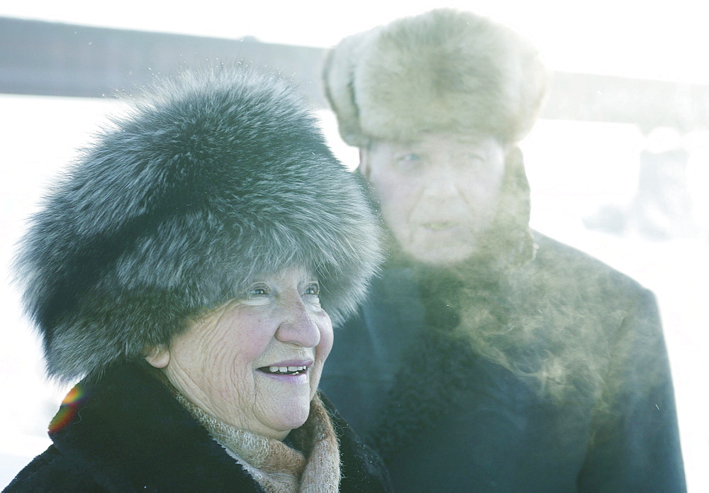 Old couple wearing fur hats, Omsk, Siberia