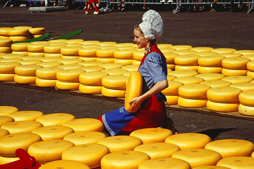 Woman in traditional clothes selling cheese, Cheese Market, Alkmaar, Netherlands