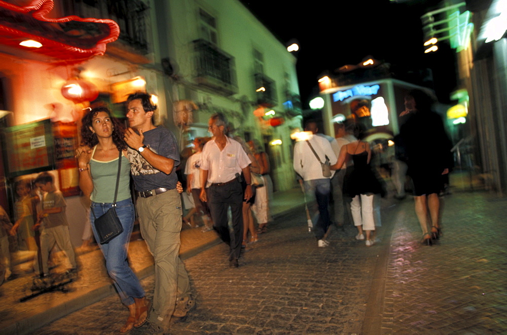 People at pedestrian area at night, Lagos, Algarve, Portugal, Europe