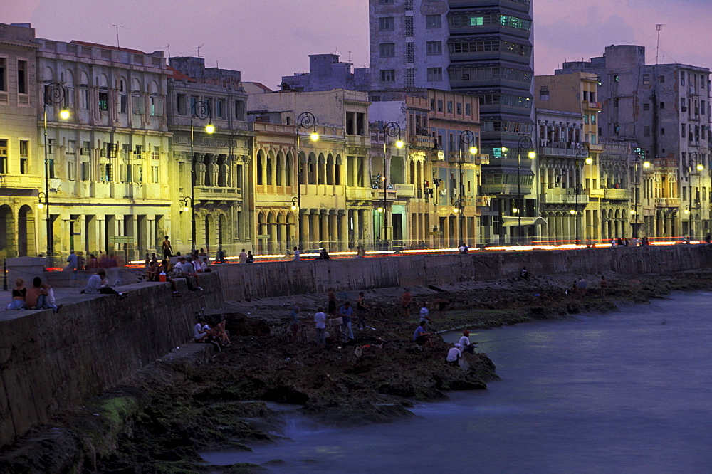 Illuminated houses at the esplanade in the evening, Malecon, Havana, Cuba, Caribbean, America