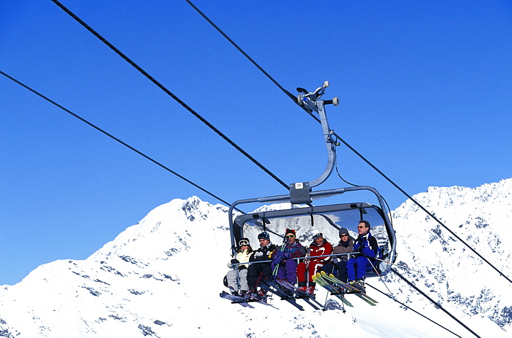 Six people sitting in a ski Lift, Skiing, Stubaital Glacier, Tirol, Austria