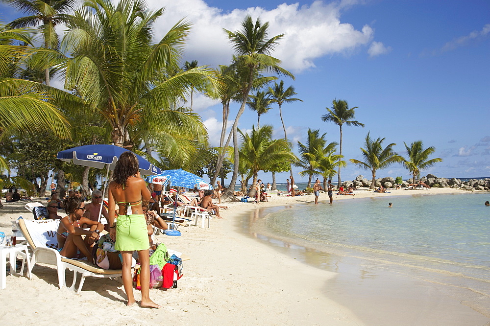 Girl selling clothes on Sainte-Anne Beach, Grande-Terre, Guadeloupe, Caribbean Sea, America