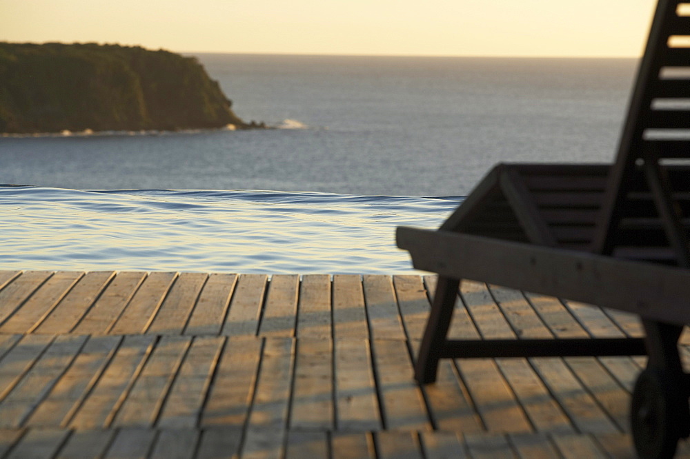 Sunlounger at the pool of Hotel Restaurant Le Rayon Vert in the evening light, Deshaies, Caribbean, America