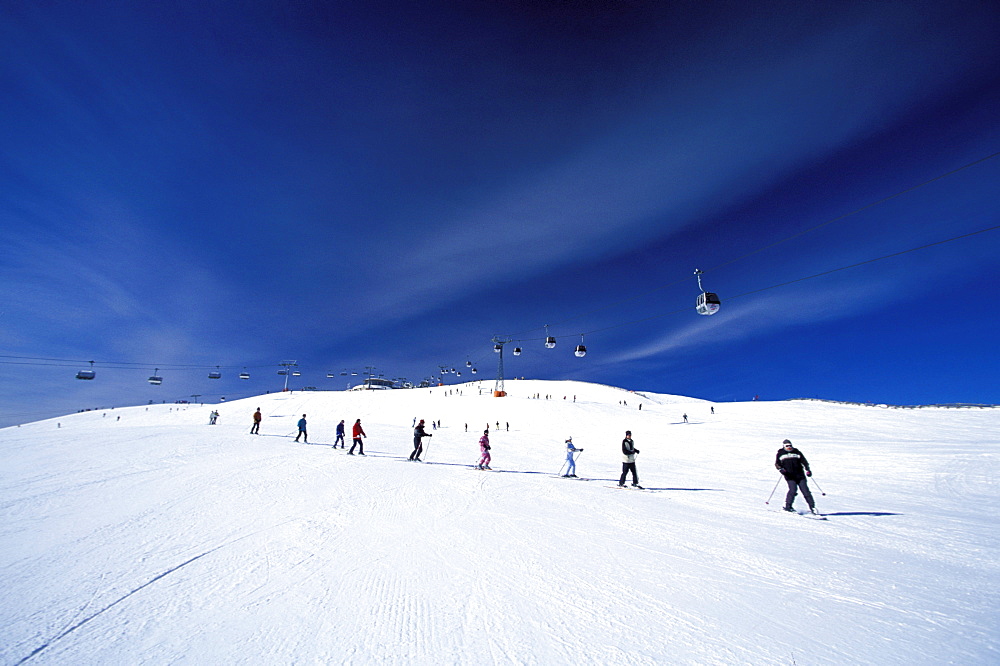 Skiers going downhill, Ski Resort Kronplatz, Plan de Corones, Dolomites, South Tyrol, Italy, Europe