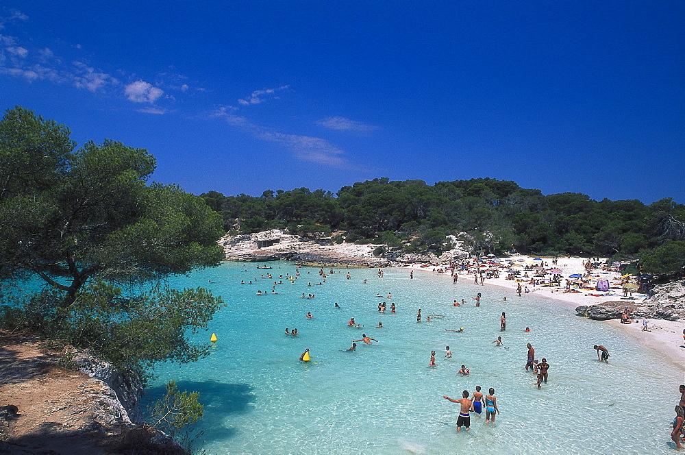 People swimming in the sea at Cala Turqueta, Minorca, Spain