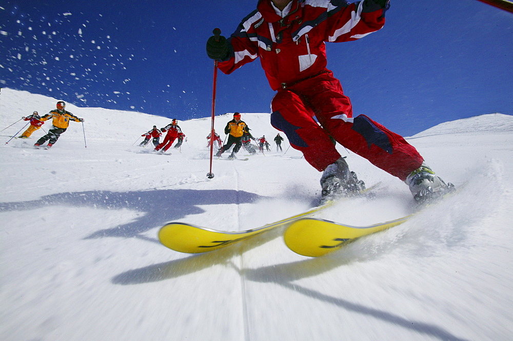 Group of skiers on the slope, Skiing downhill, Sulden, Italy