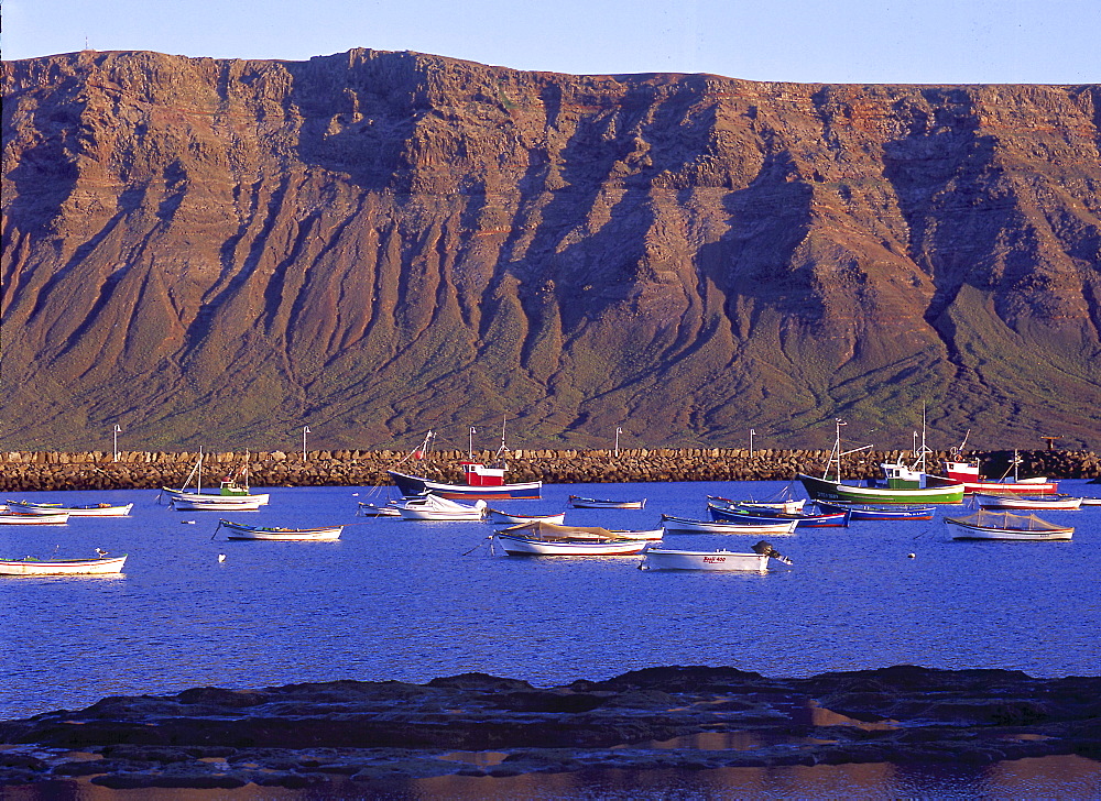 Fishing boats in the harbour, Famara Lanzarote of Caleta del Sebo, La Graciosa, Canary Islands, Spain