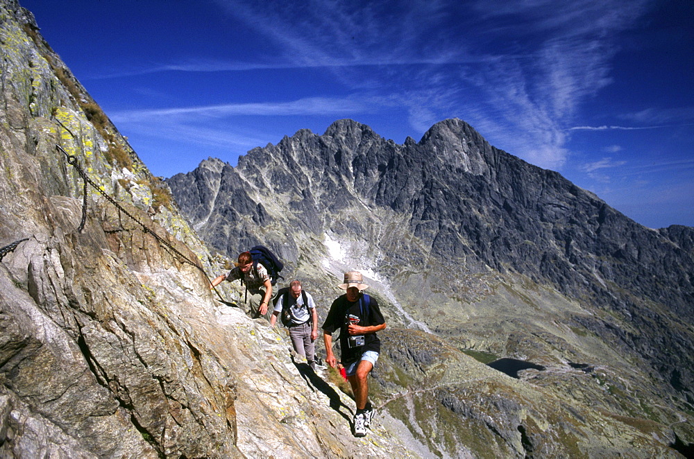 Hikers in front of the Lomnica Peak, High Tatras, Slovakia