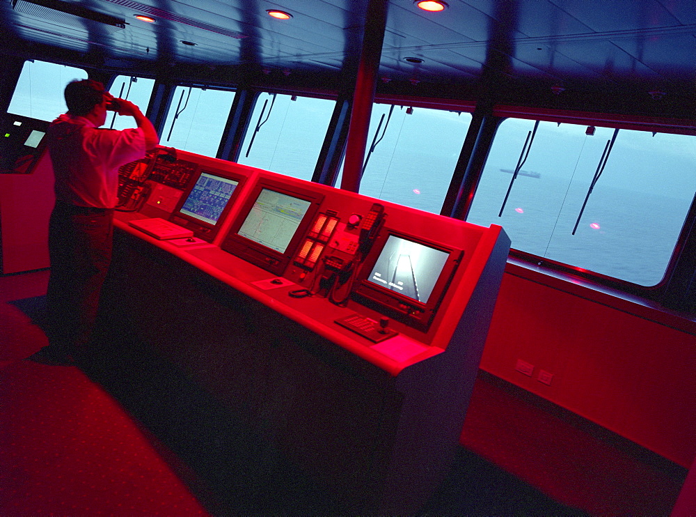 Screens and radars on the command bridge of the Queen Mary 2, Cruise Ship