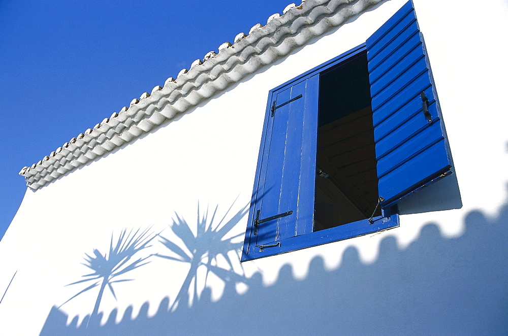 Window and shadows on the wall of a house, Koroni, Messinia, Peloponnese, Greece