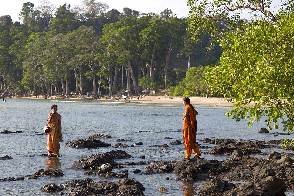 Two Indian women bathing in the water, Chiriya Tapu beach, South Andaman, Andaman Islands, India