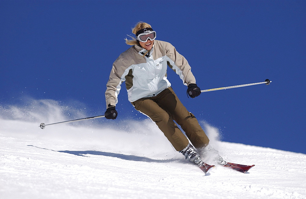 Woman skiing in the Alps, Wintersports, Lech, Austria