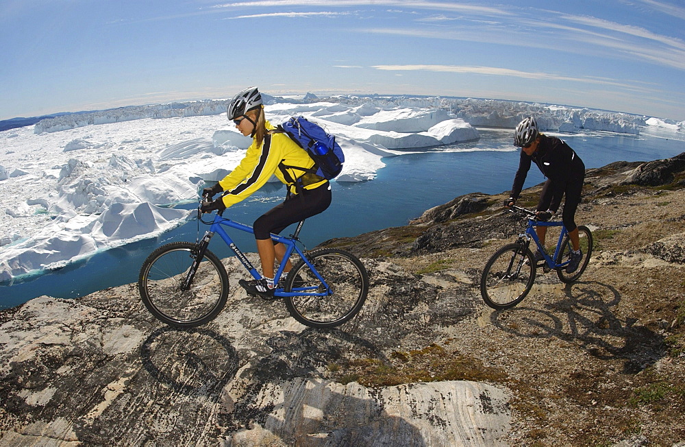 A couple on a mountainbike tour, Ilulissat, Greenland