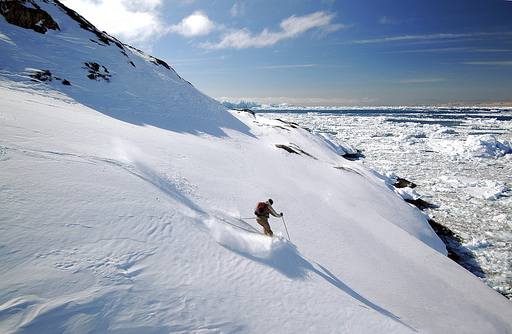 Person skiing down a slope, Ilulissat, Greenland