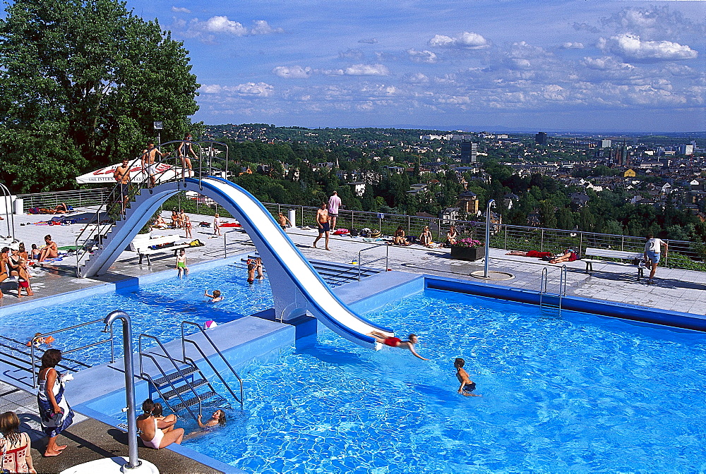 People at open air pool Opelbad, Neroberg, view over Wiesbaden, Hesse, Germany, Europe