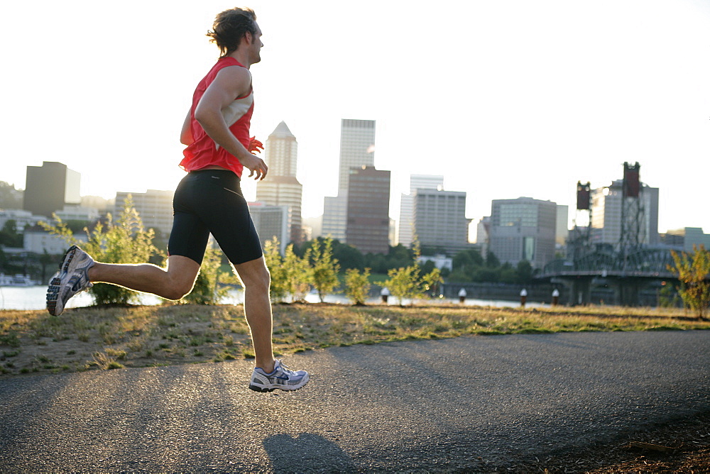 Runner running along the river shore, Portland, Relay Race from Mount Hood to the coast, Hood to Coast, Oregon, USA