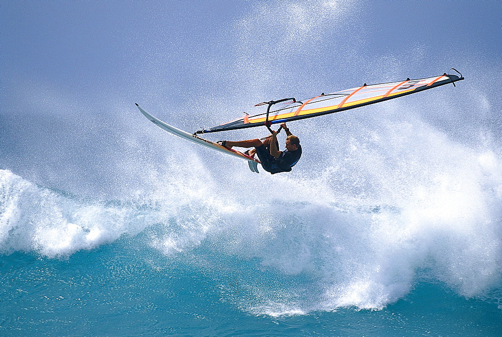 A man with sailboard during a jump, Hawaii, USA, America