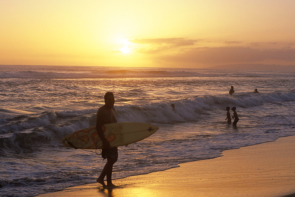 Surfer at Sunset, Kekaha Beach Park, Kekaha, Kauai, Hawaii, USA