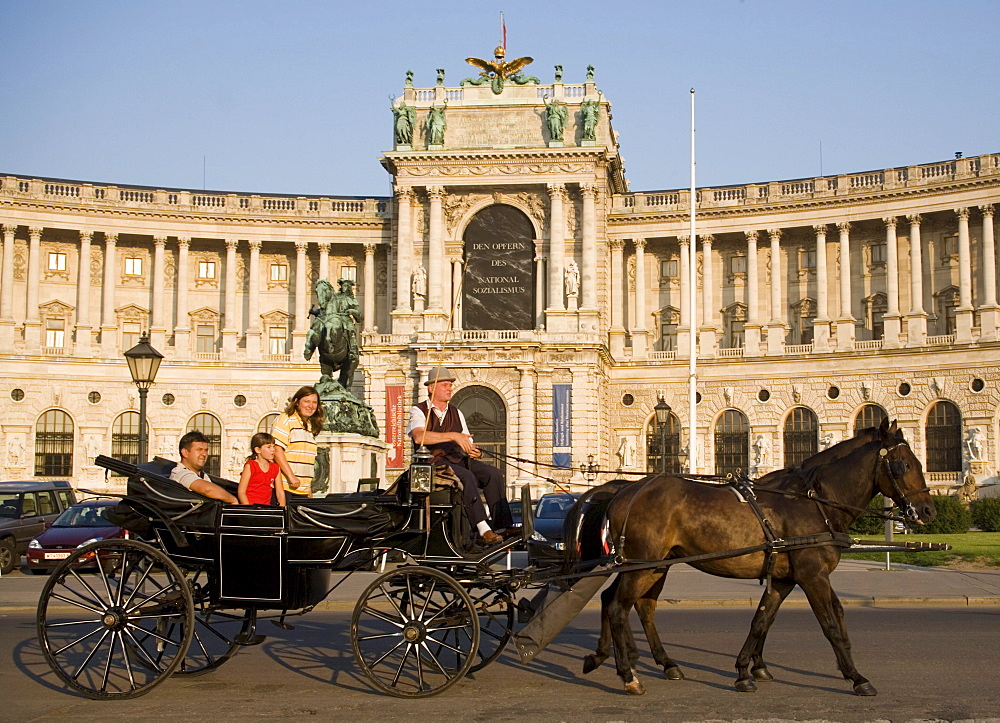 Fiaker passing the Neue Hofburg during a city tour, Vienna, Austria