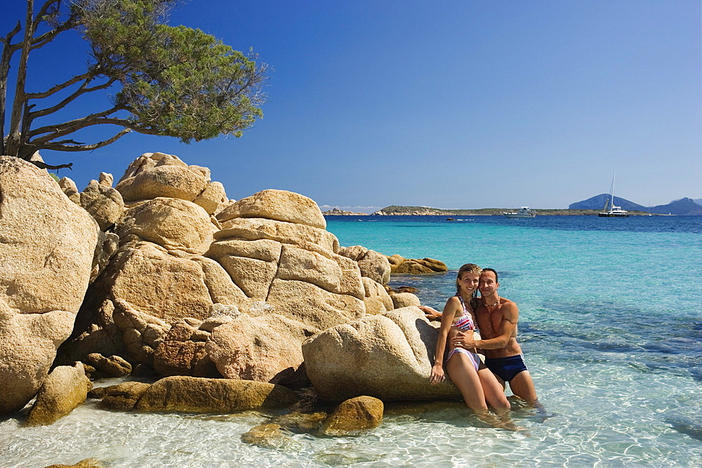 Couple at Spiaggia Capriccioli, Sardinia, Italy