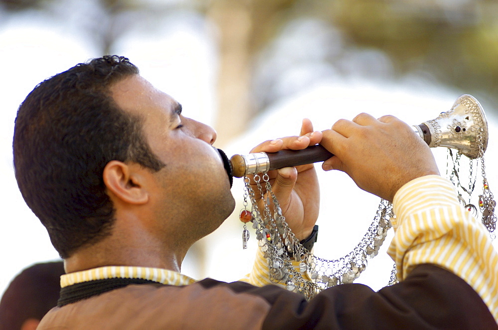 Turkish middle-aged man playing Zurna with silver decorations, Tuerkei