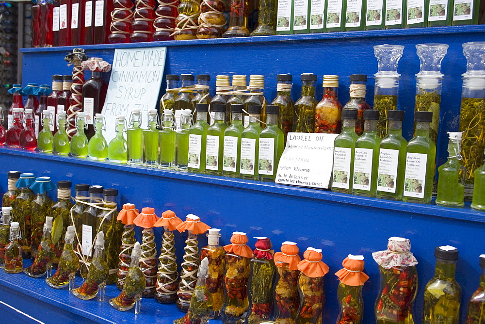 Different bottles with oil and syrup in a souvenir shop, Zia, Kos, Greece