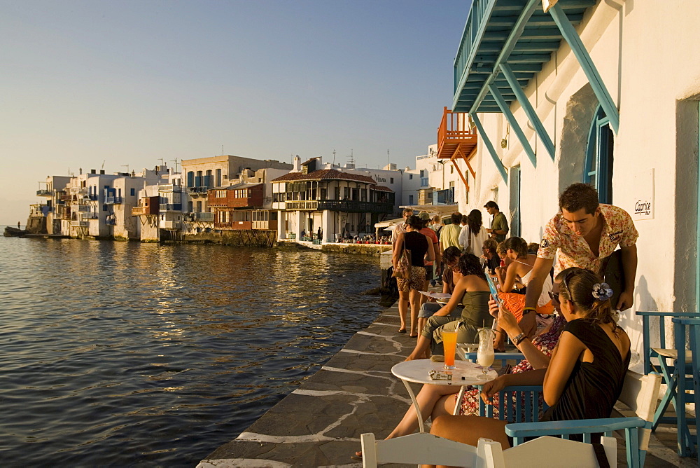 People sitting in the Caprice Bar directly at sea, Little Venice, Mykonos-Town, Mykonos, Greece