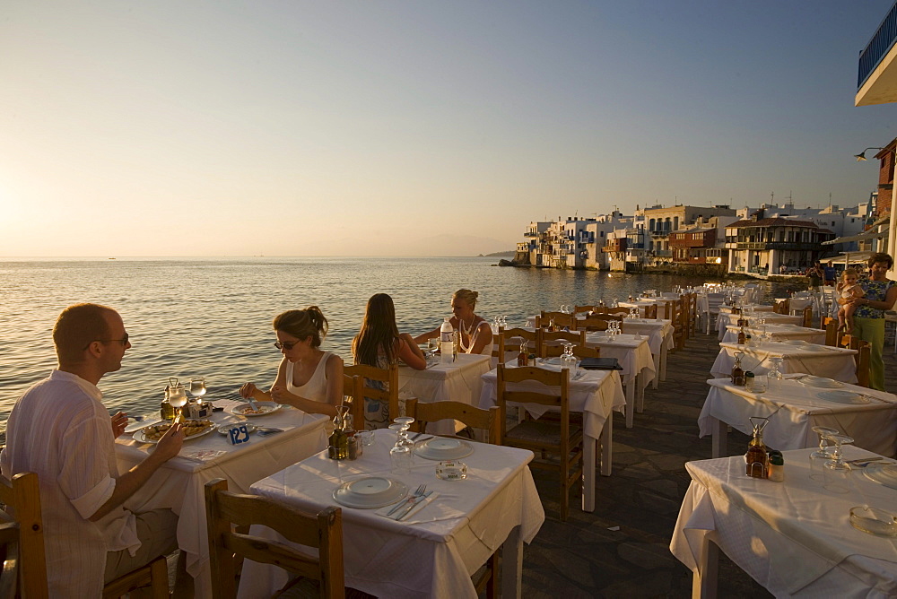 People sitting in a restaurant at beach, Little Venice, Mykonos-Town, Mykonos, Greece