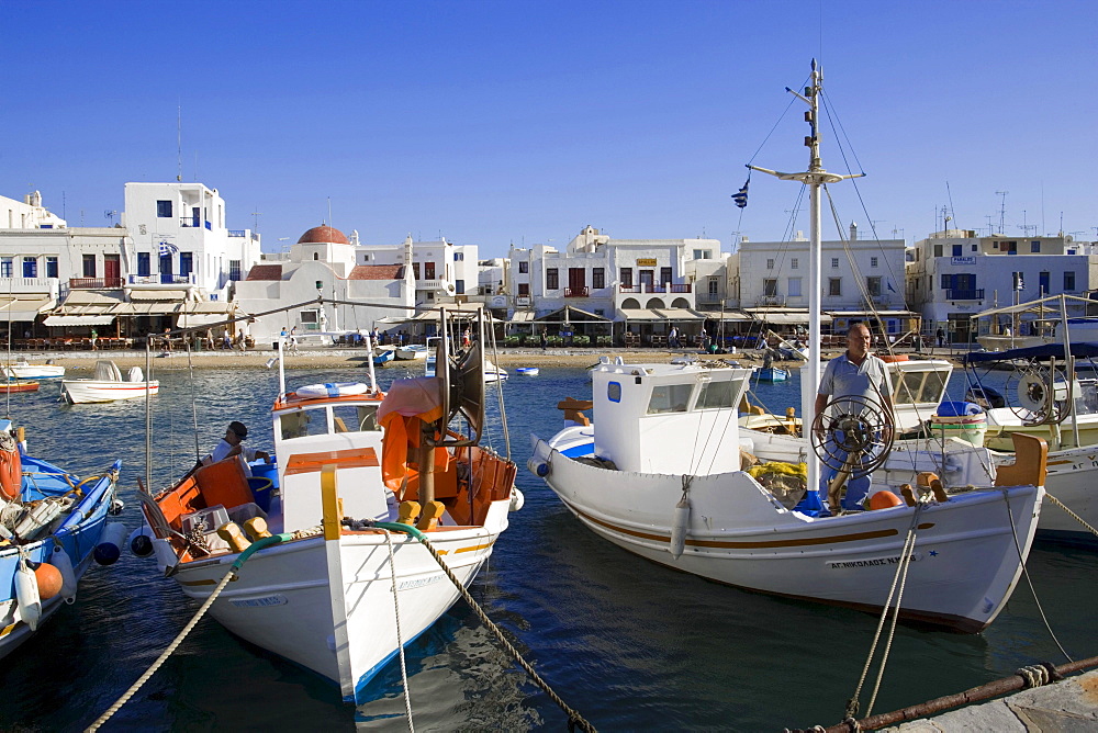 Fishermen on their boats in the harbour, Mykonos-Town, Mykonos, Greece