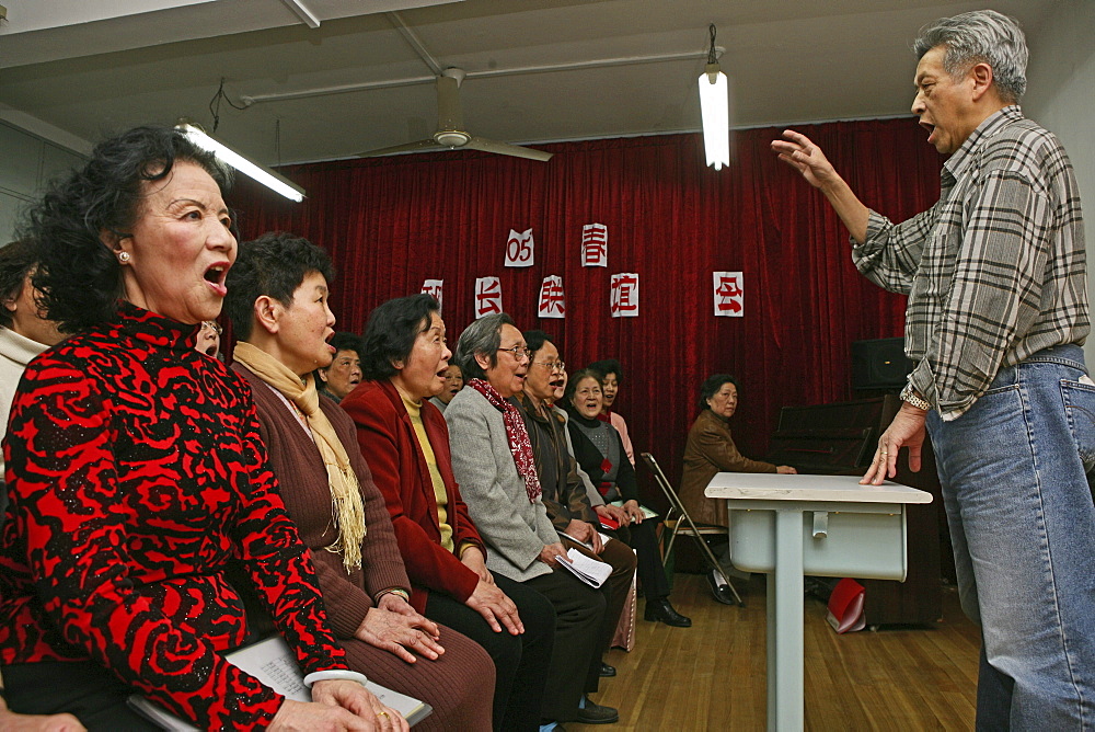 Singer and music conductor Peter Zhang, the former singer of revolutionary operas is now free to choose the songs he prefers, chorus of hobby singers