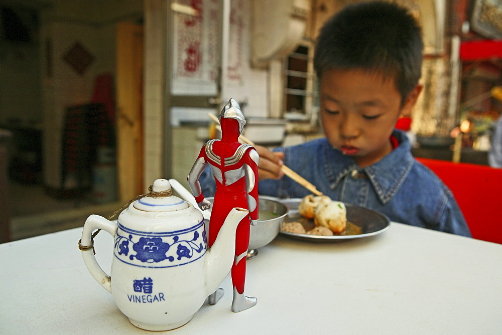 kid, child, young boy Superman toy eating dumpling, biaozi, Little Emperor