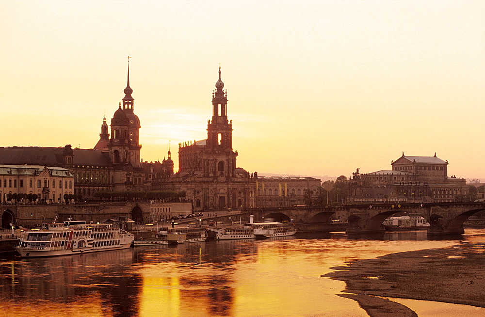 Europe, Germany, Saxony, Dresden, Skyline of Dresden with Bruehlsche terrace, Residenzschloss, Staendehaus, Haussman Tower and Catholic Court Church and Semper Opera seen from Carola bridge on Elbe River