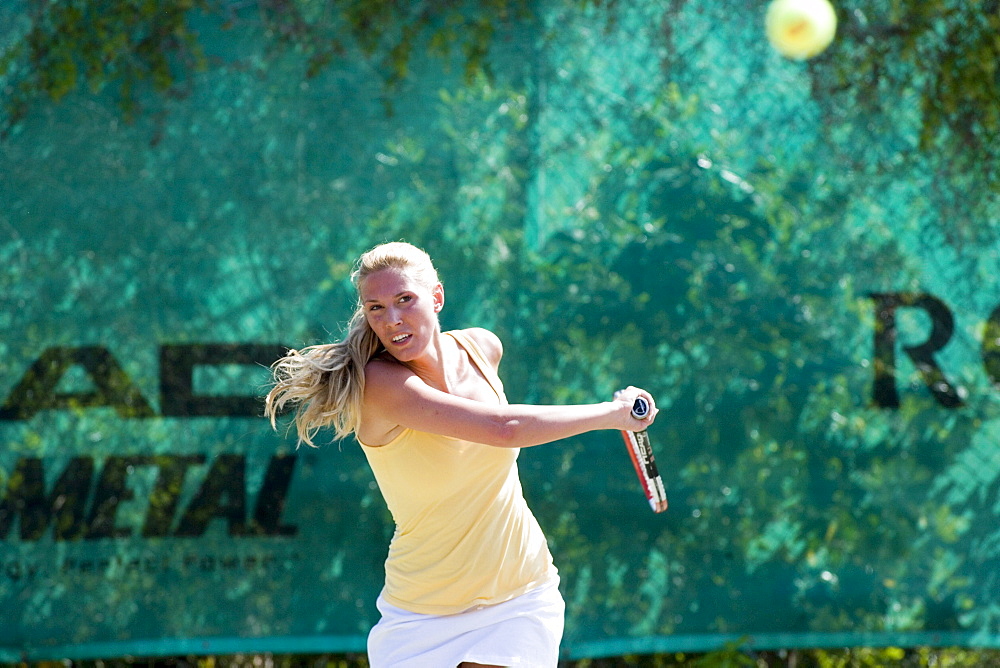 Young woman playing tennis, Apulia, Italy