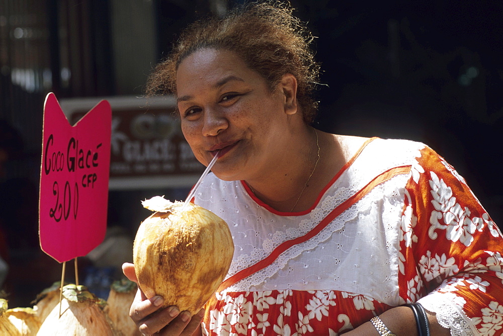 Woman Sipping Chilled Coconut Water, Papeete Municipal Market, Papeete, Tahiti, French Polynesia