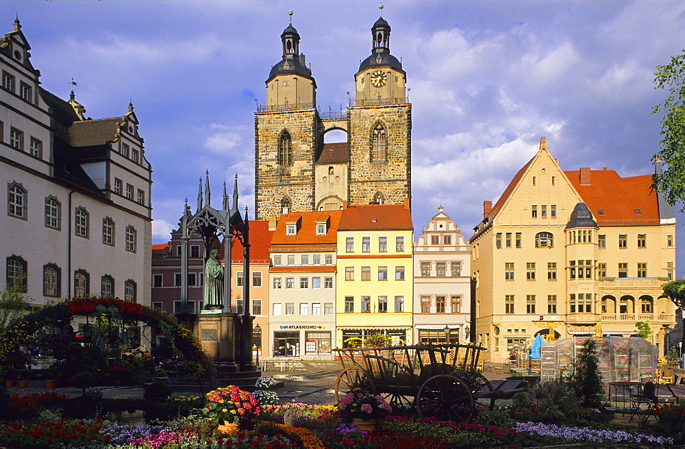 Europe, Germany, Saxony Anhalt, the memorial of Martin Luther on the market square in front of the town hall and Saint Mary's Church in Wittenberg