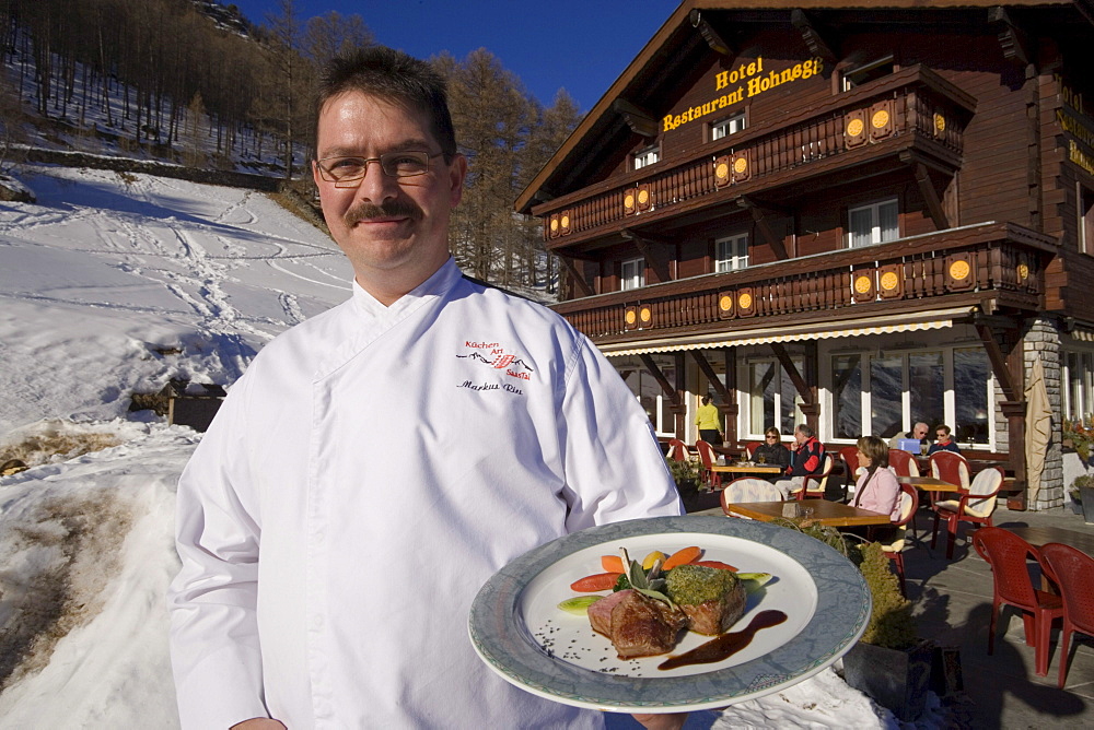 Chef Markus Riess serving a meal, Hotel and Restaurant Hohnegg, Saas-Fee, Valais, Switzerland