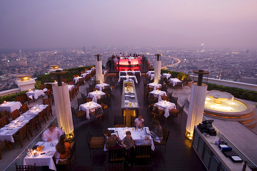 View over openair-bar "Sirocco Sky Bar" and Bangkok in the evening, State Tower, 247 m, The Dome, Bangkok, Thailand