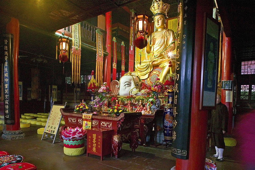 Golden statue of Buddha with white elephant at Wannian monastery, Emei Shan, Sichuan province, China, Asia