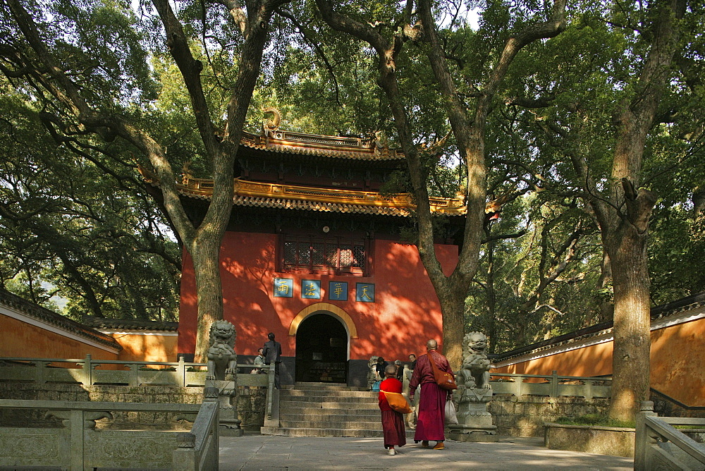 People in front of the red gate of the Fayu monastery, Putuo Shan Island, Zhejiang province, China, Asia